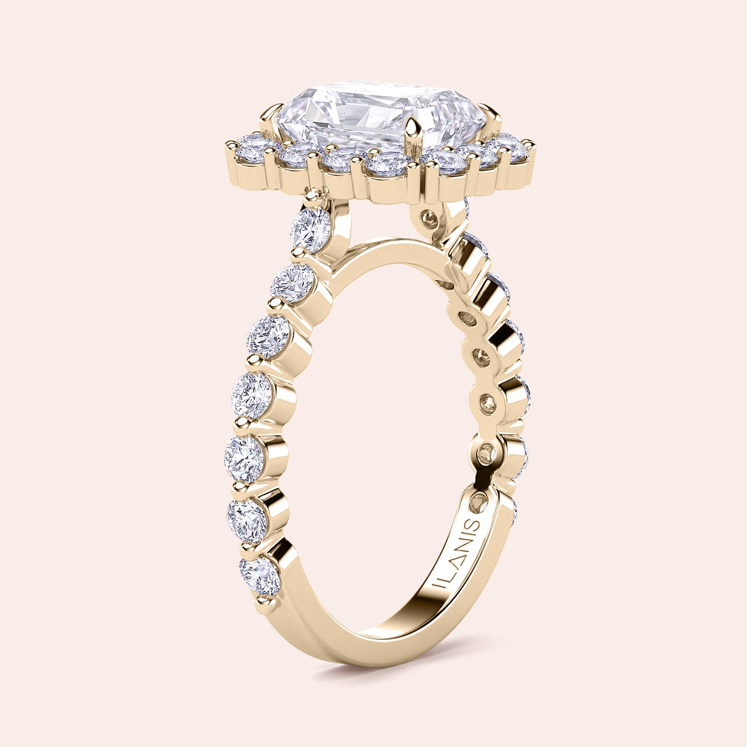 Angled view of radiant-cut halo diamond ring highlighting detailed diamond-studded band crafted in yellow gold | 

#14KRecycledYellowGold #18KRecycledYellowGold