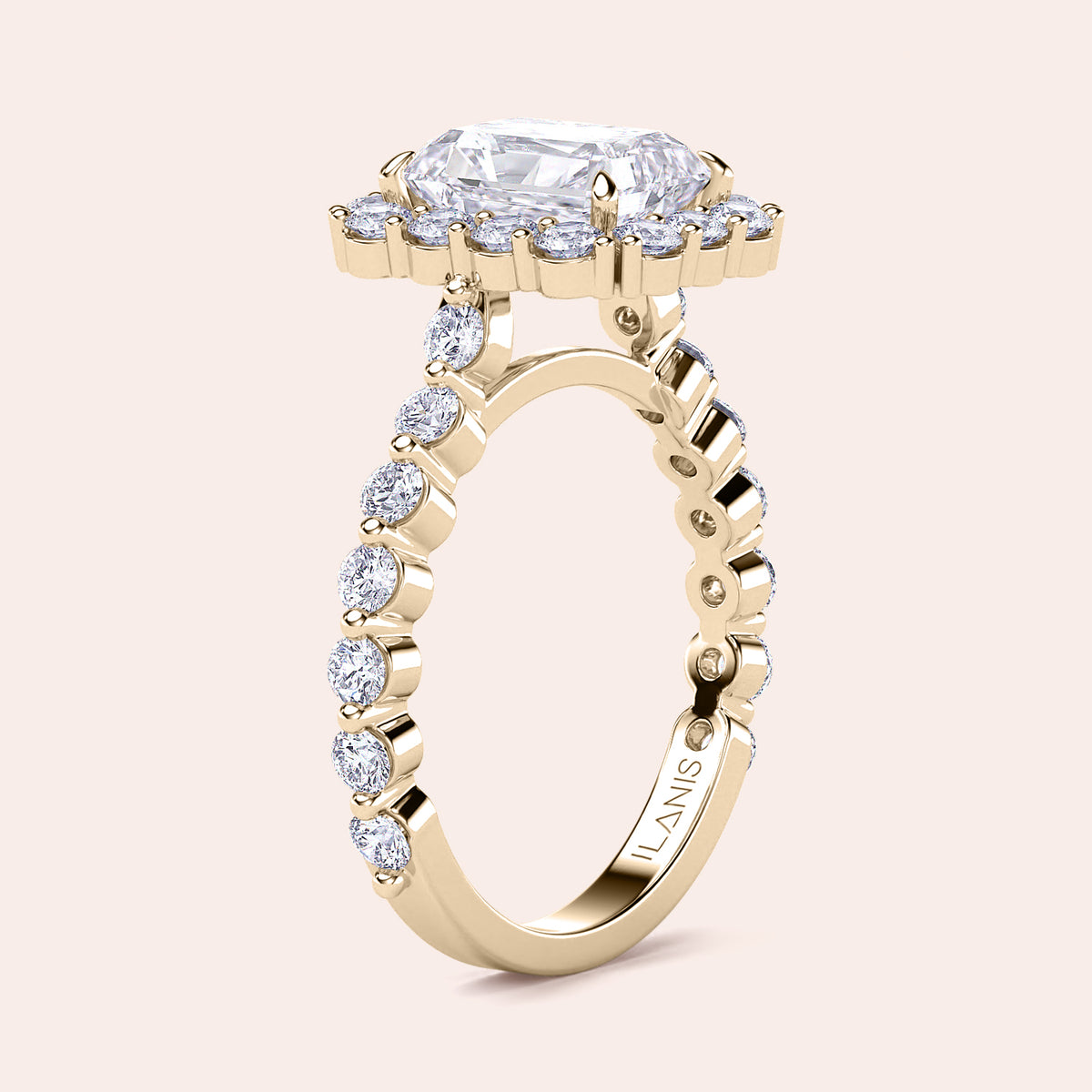 Angled view of radiant-cut halo diamond ring highlighting detailed diamond-studded band crafted in yellow gold 
