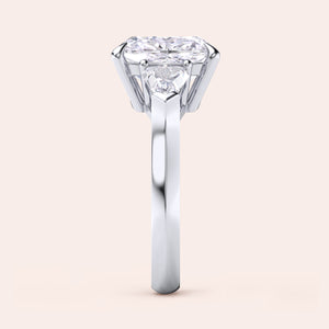 Stunning 14K/18K white gold trilogy engagement ring cushion cut center diamond, and shield side stones. 