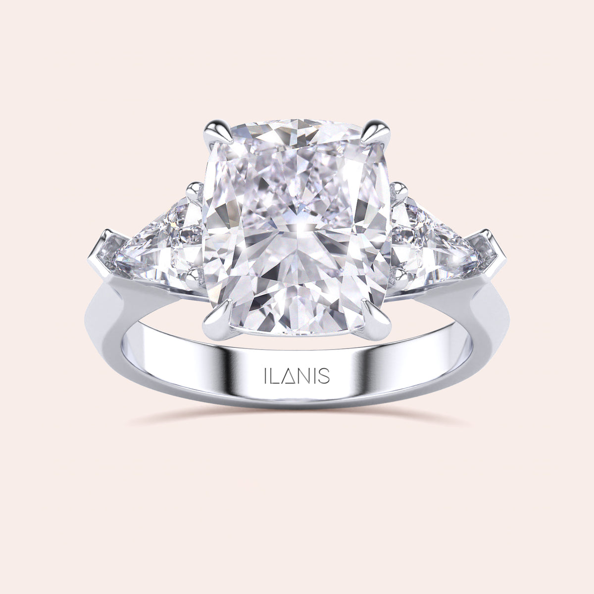 Stunning 14K/18K white gold trilogy engagement ring cushion cut center diamond, and shield side stones.