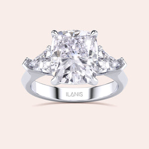 Stunning 14K/18K white gold trilogy engagement ring cushion cut center diamond, and shield side stones.