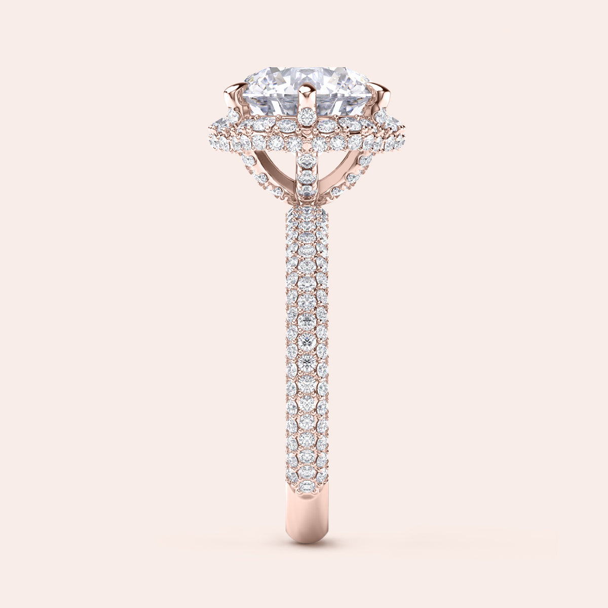 Side profile of a rose gold cushion-cut diamond engagement ring, highlighting intricate design elements and a diamond-studded band that exudes sophistication. 
