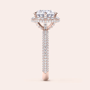 Side profile of a rose gold cushion-cut diamond engagement ring, highlighting intricate design elements and a diamond-studded band that exudes sophistication. 