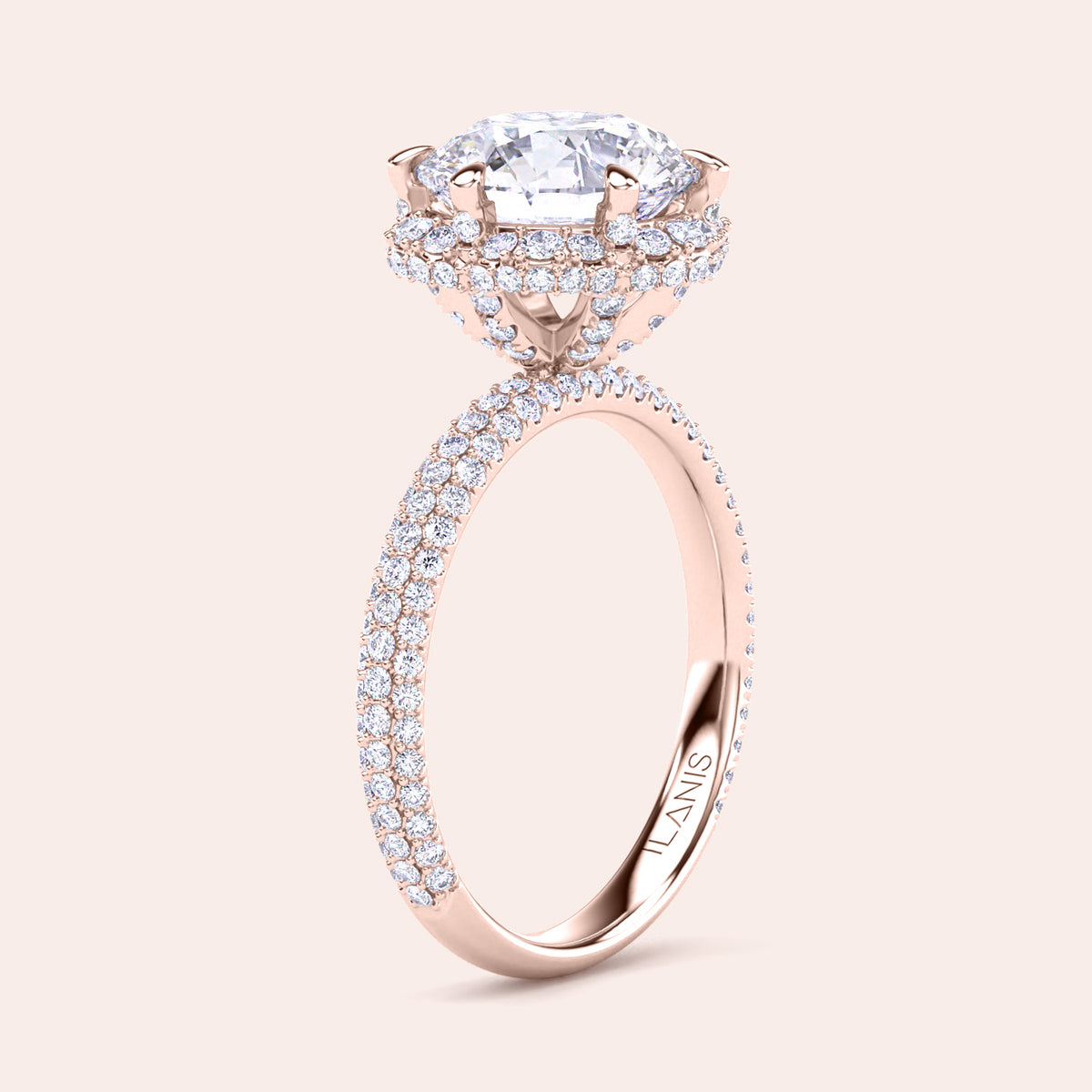 Exquisite rose gold engagement ring featuring a halo of pavé-set diamonds around a radiant cushion-cut center stone, mounted on a fully diamond-encrusted band. 