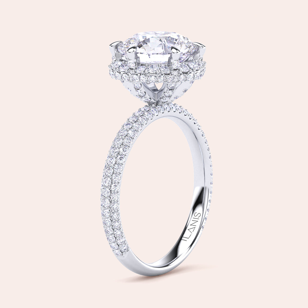 Exquisite white gold engagement ring featuring a halo of pavé-set diamonds around a radiant cushion-cut center stone, mounted on a fully diamond-encrusted band. 