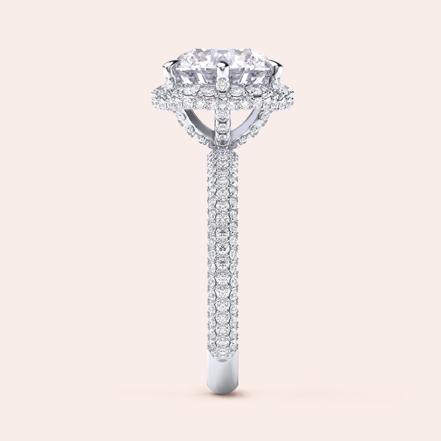 : "Side profile of a white gold cushion-cut diamond engagement ring, highlighting intricate design elements and a diamond-studded band that exudes sophistication. | #14KRecycledWhiteGold #18KRecycledWhiteGold #Platinum