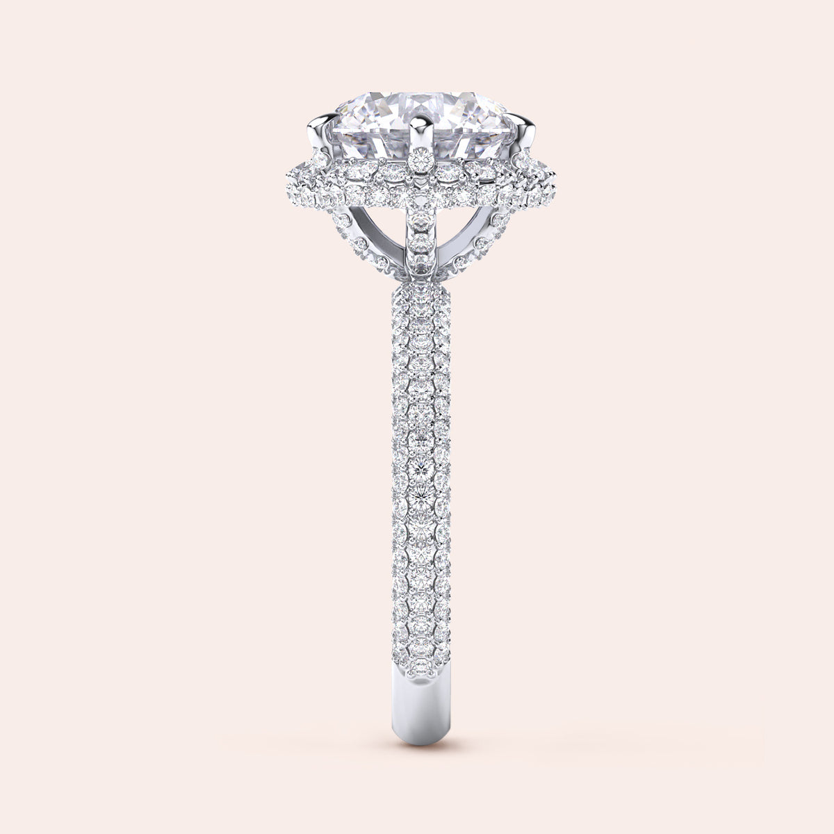 : "Side profile of a white gold cushion-cut diamond engagement ring, highlighting intricate design elements and a diamond-studded band that exudes sophistication. 
