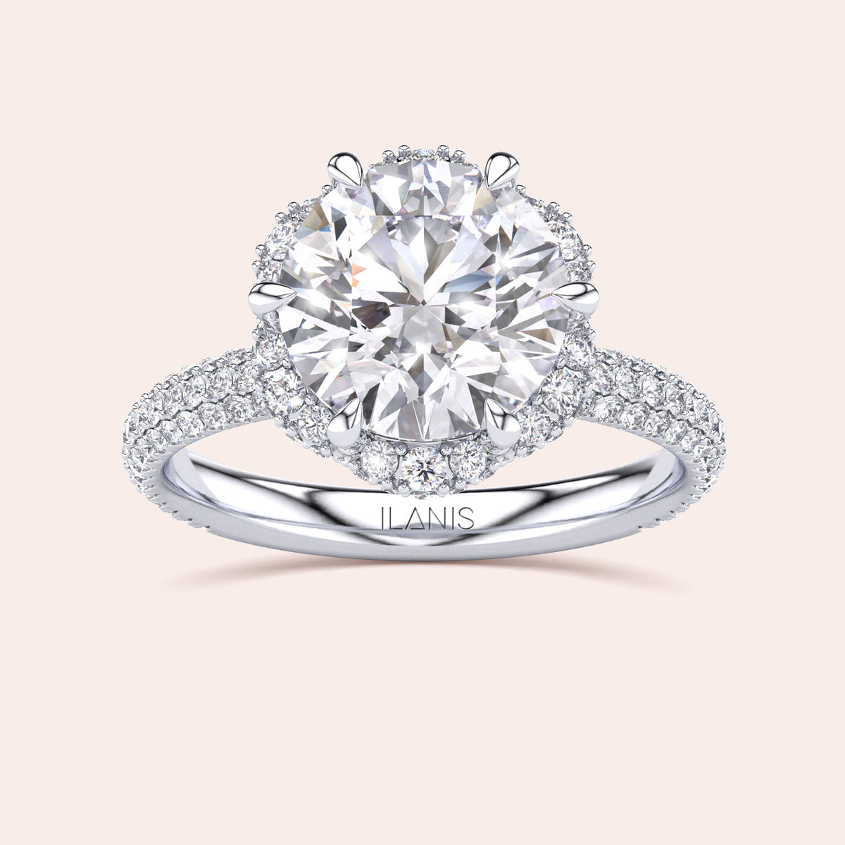 Top view of a white gold engagement ring showcasing a cushion-cut diamond encircled by a detailed double halo setting, emphasizing timeless elegance. 