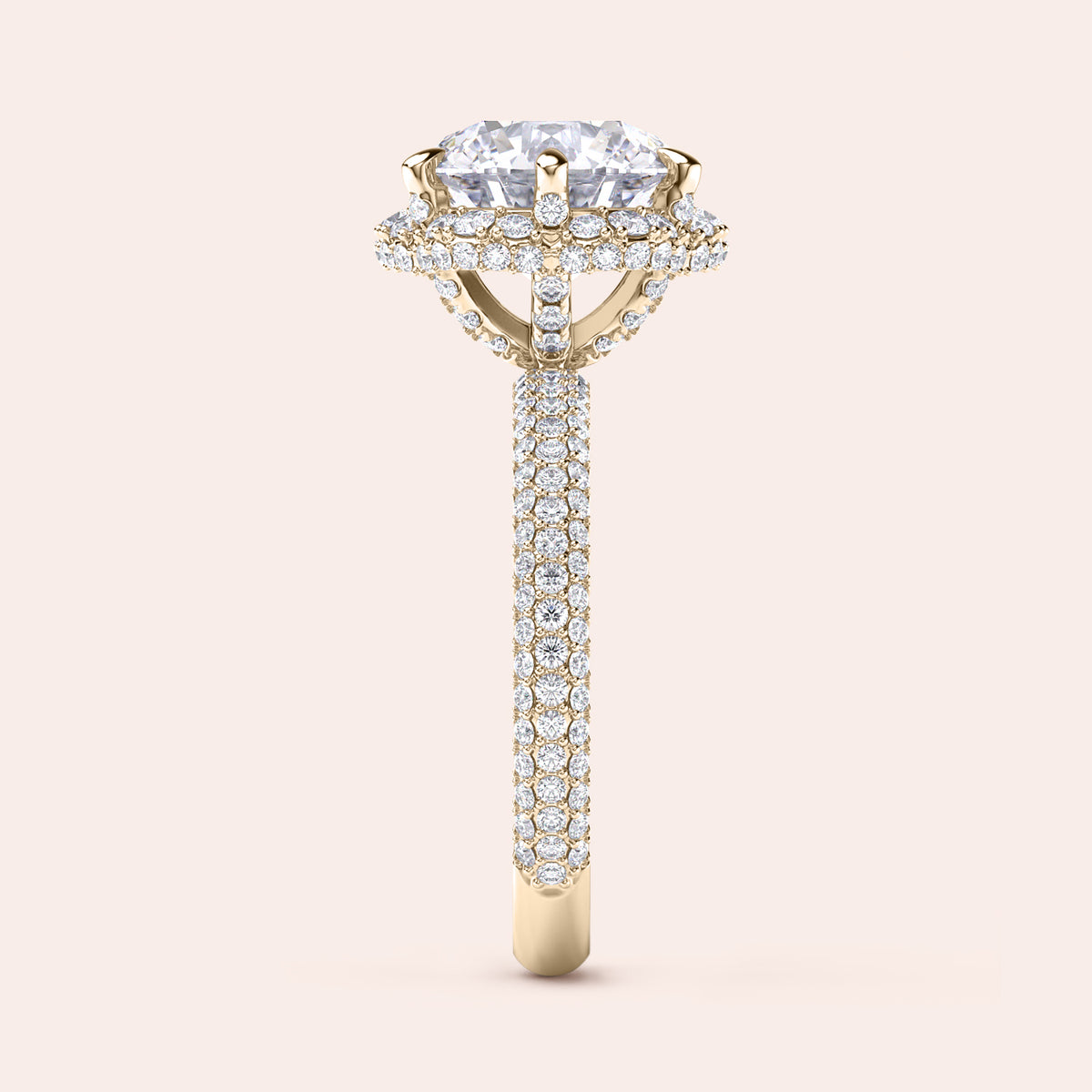 Side profile of a yellow gold cushion-cut diamond engagement ring, highlighting intricate design elements and a diamond-studded band that exudes sophistication. 