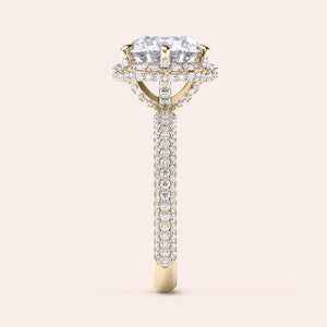 Side profile of a yellow gold cushion-cut diamond engagement ring, highlighting intricate design elements and a diamond-studded band that exudes sophistication. 