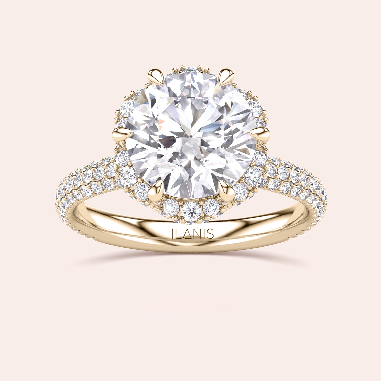 Top view of a yellow gold engagement ring showcasing a cushion-cut diamond encircled by a detailed double halo setting, emphasizing timeless elegance. | #14KRecycledYellowGold #18KRecycledYellowGold