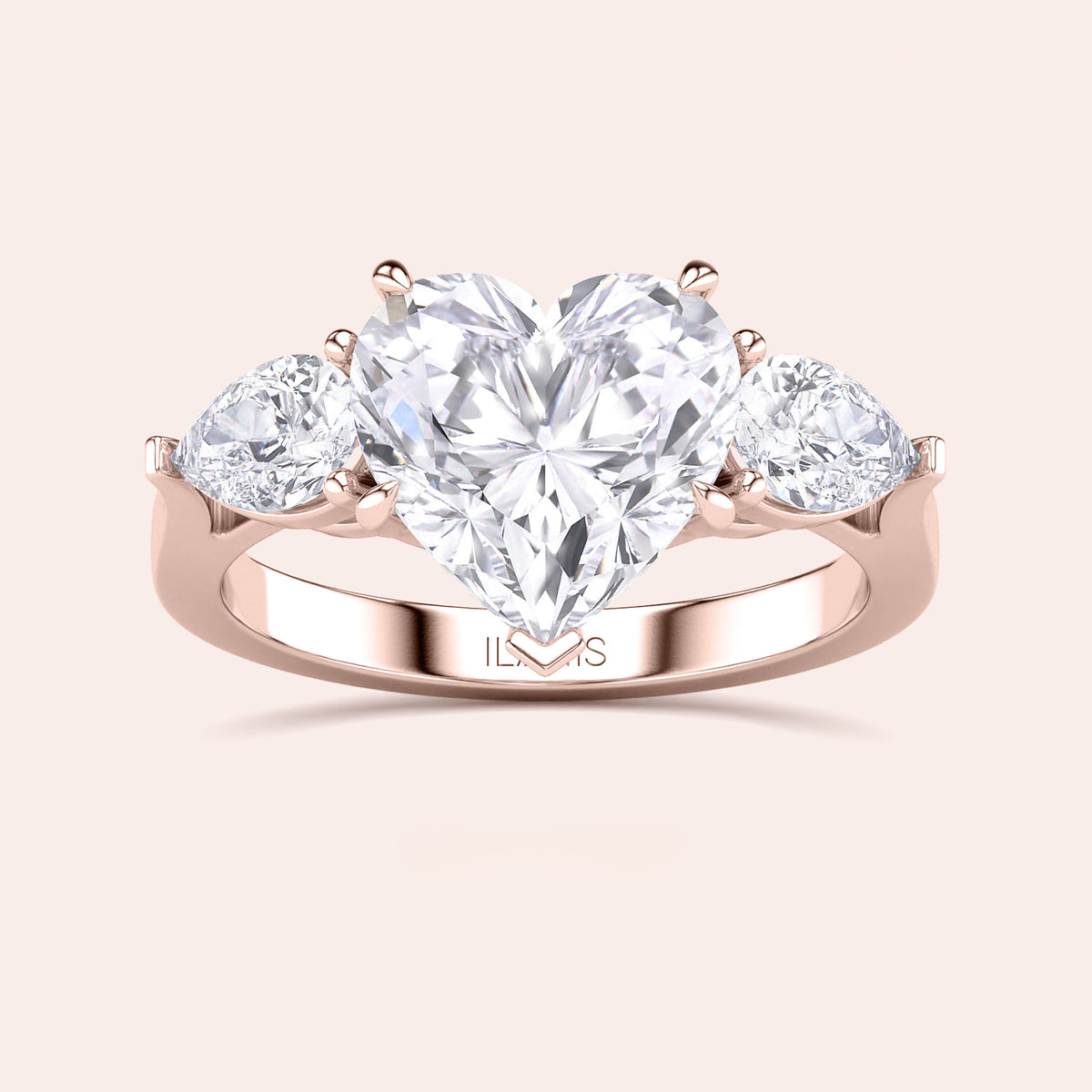 Close-up of a rose gold engagement ring with a heart-shaped diamond center and teardrop diamond accents along the band, reflecting sophisticated craftsmanship. 