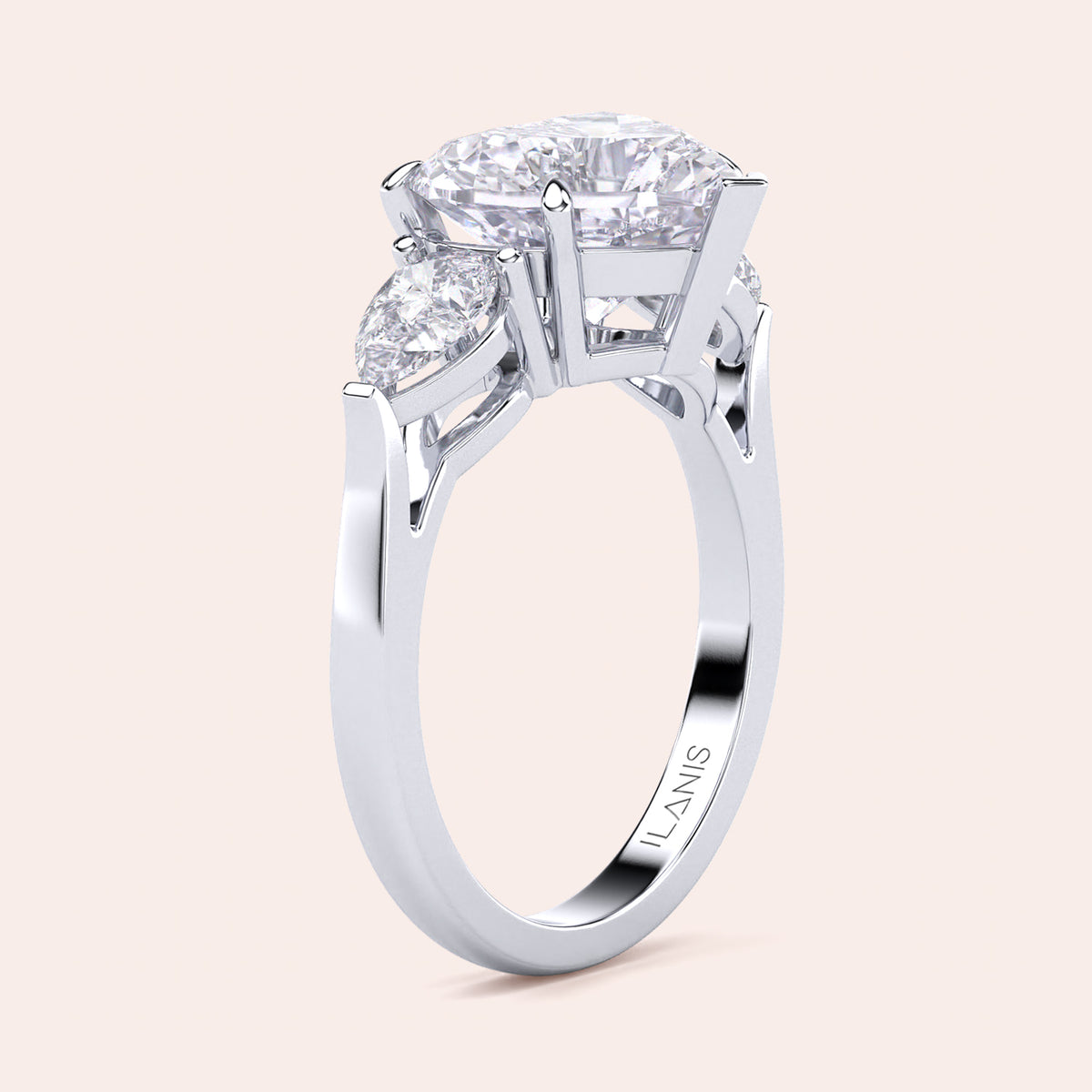 Unique white gold engagement ring featuring a heart-shaped central diamond flanked by teardrop side diamonds, exemplifying romantic elegance. 