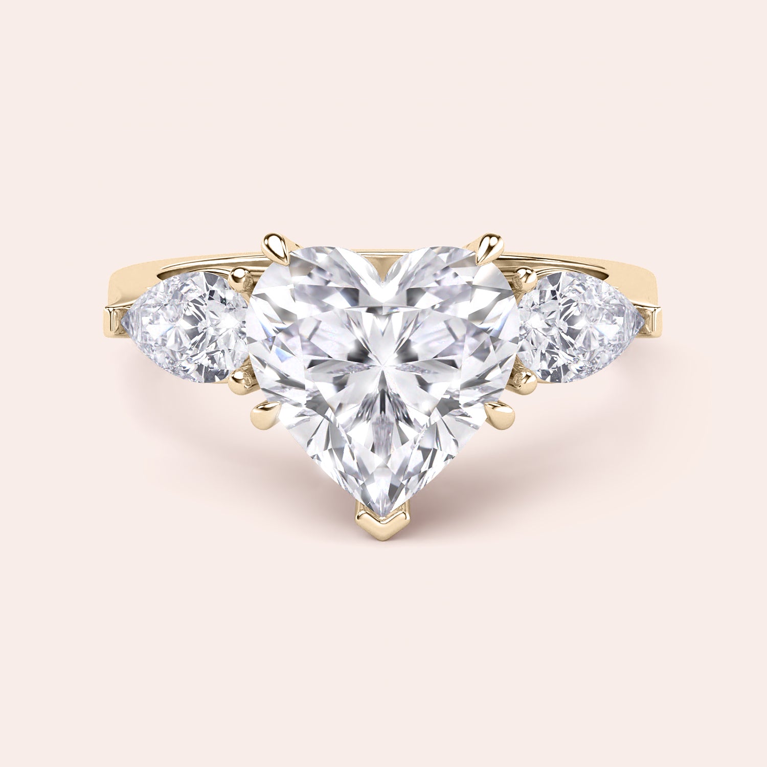 Close-up of a yellow gold engagement ring with a heart-shaped diamond center and teardrop diamond accents along the band, reflecting sophisticated craftsmanship. 