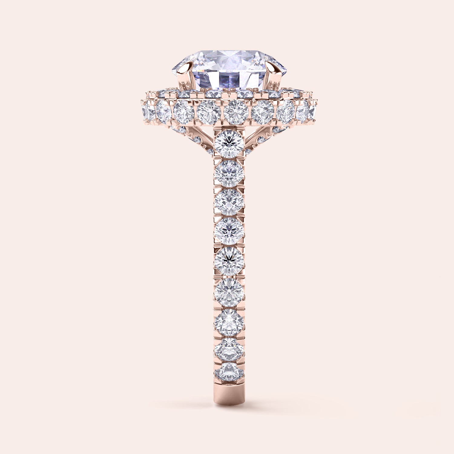 Side view of a rose gold round-cut diamond halo engagement ring, showcasing a complex halo setting that enhances the ring’s luxury and depth. | #14KRecycledRoseGold #18KRecycledRoseGold