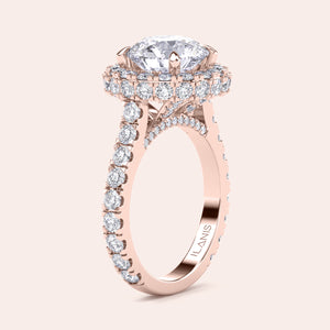 Elegant rose gold engagement ring with a brilliant round-cut diamond center, encircled by a dazzling halo of smaller diamonds, adding opulence and sparkle. 