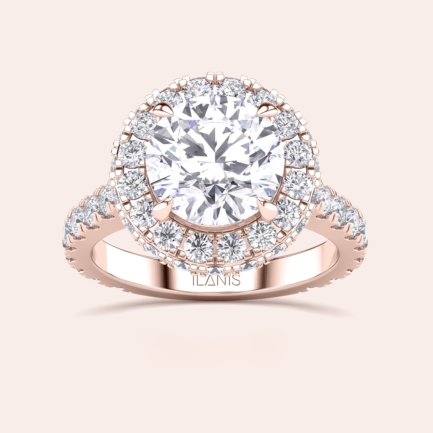 Close-up of a rose gold halo engagement ring, emphasizing the intricate detailing and brilliance of its round-cut diamond centerpiece. | #14KRecycledRoseGold #18KRecycledRoseGold