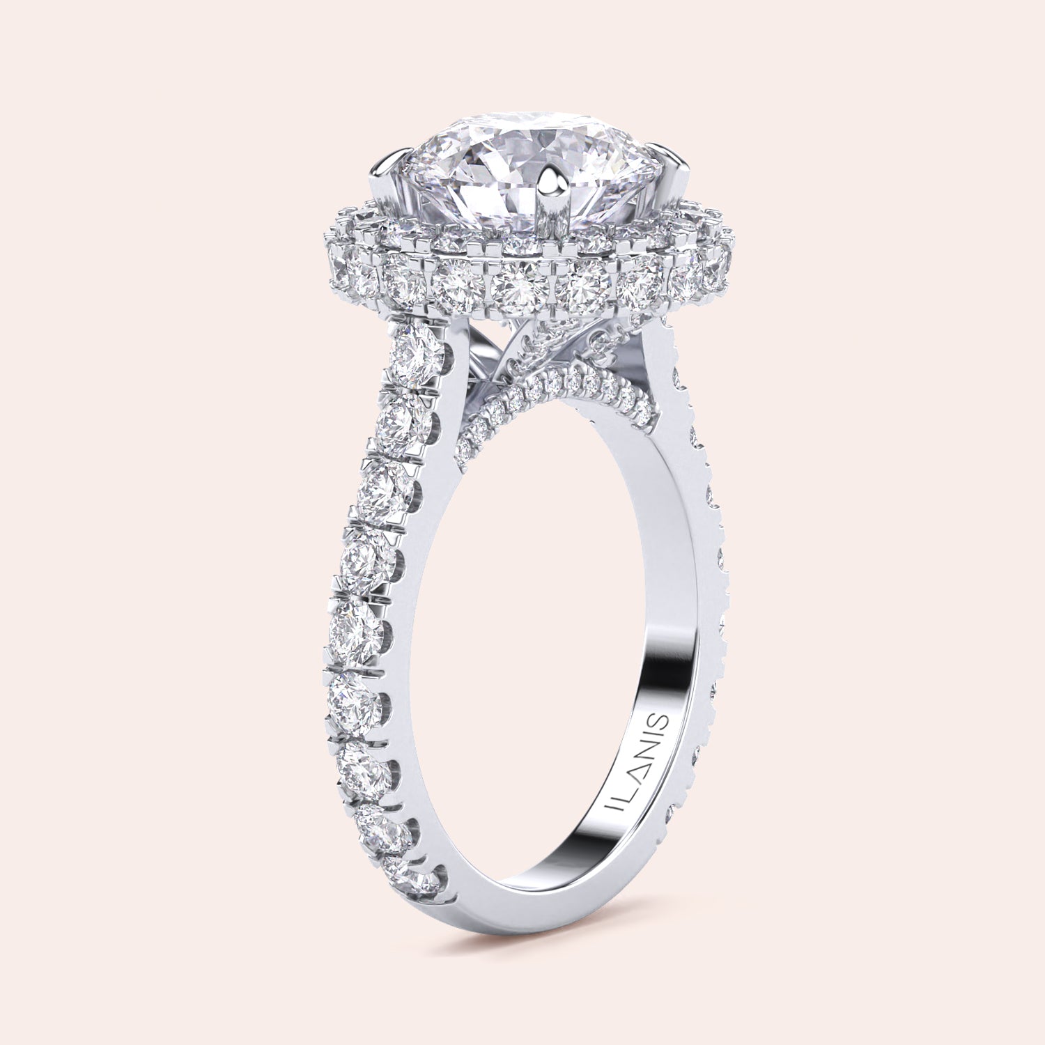 Elegant white gold engagement ring with a brilliant round-cut diamond center, encircled by a dazzling halo of smaller diamonds, adding opulence and sparkle. | #14KRecycledWhiteGold #18KRecycledWhiteGold #Platinum