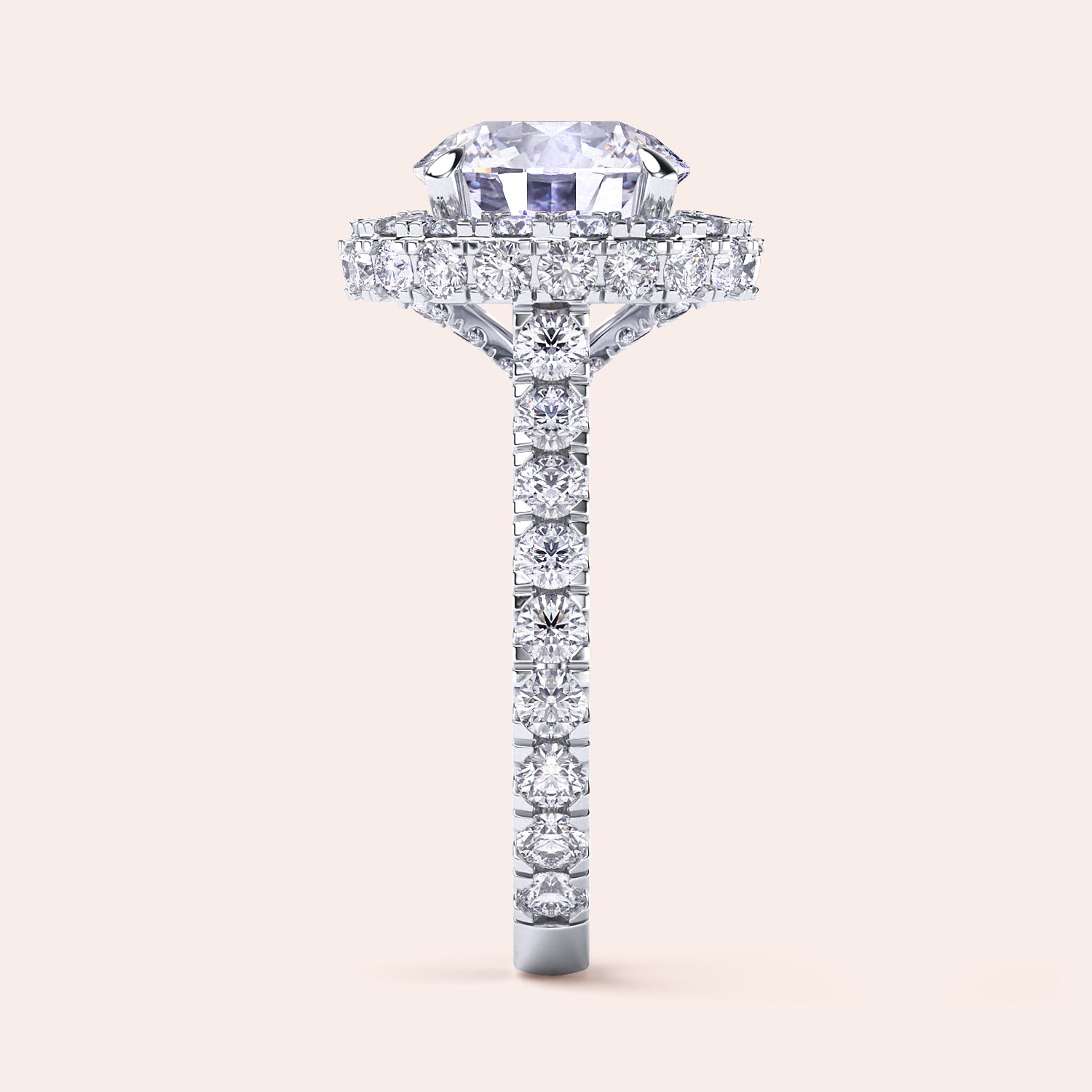 Side view of a white gold round-cut diamond halo engagement ring, showcasing a complex halo setting that enhances the ring’s luxury and depth. | #14KRecycledWhiteGold #18KRecycledWhiteGold #Platinum