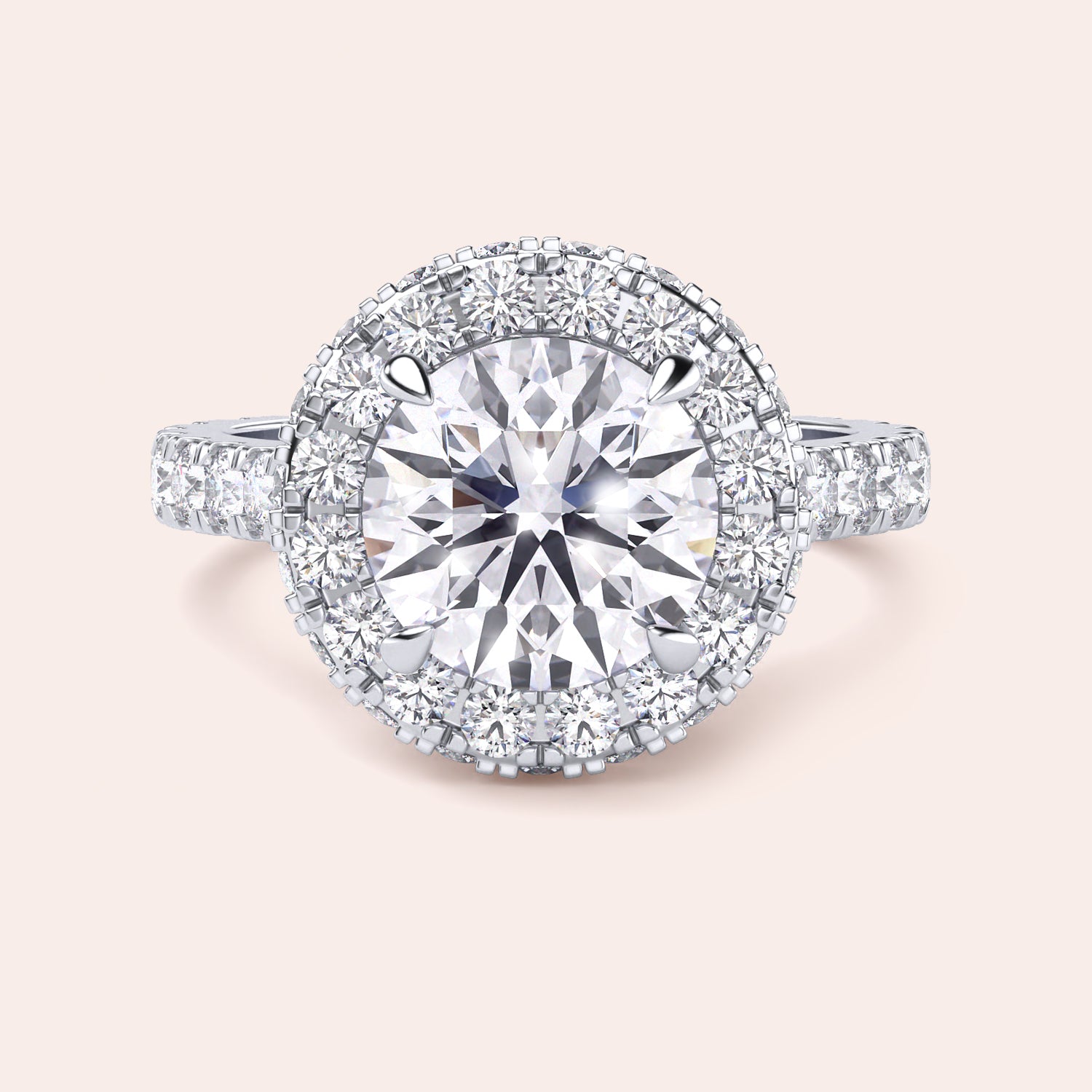 Close-up of a white gold halo engagement ring, emphasizing the intricate detailing and brilliance of its round-cut diamond centerpiece. | #14KRecycledWhiteGold #18KRecycledWhiteGold #Platinum