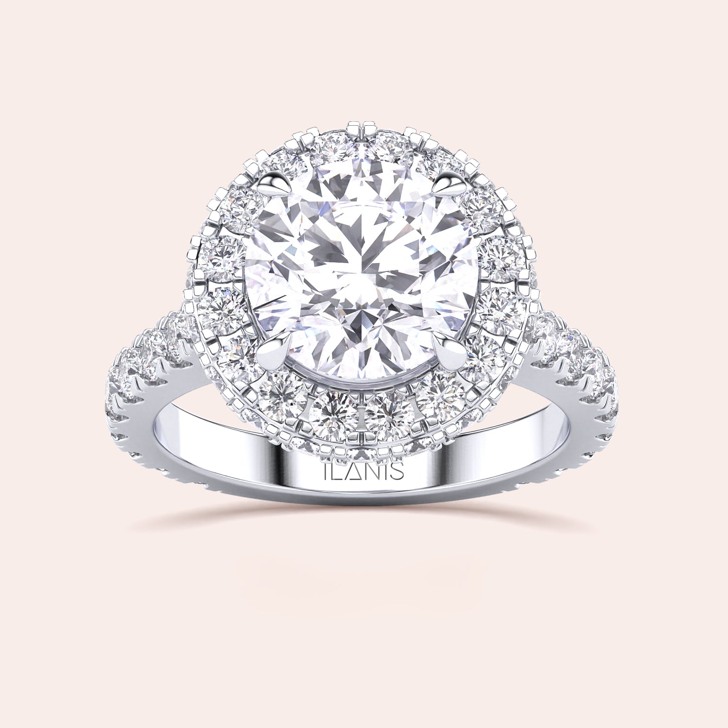 Top view of a white gold engagement ring featuring a round-cut diamond with a halo, elegantly designed to catch the light and mesmerize. | #14KRecycledWhiteGold #18KRecycledWhiteGold #Platinum
