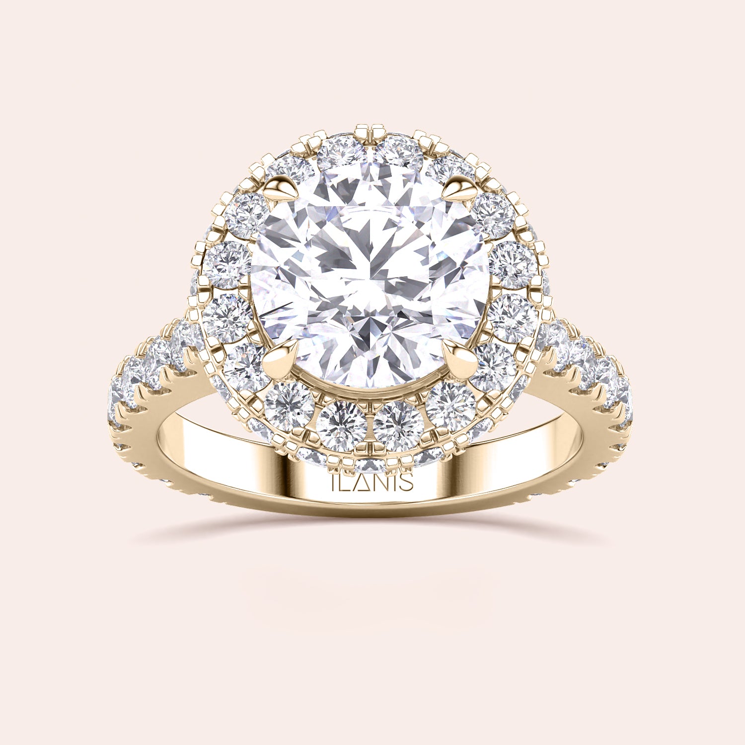 Top view of a yellow gold engagement ring featuring a round-cut diamond with a halo, elegantly designed to catch the light and mesmerize. | #14KRecycledYellowGold #18KRecycledYellowGold