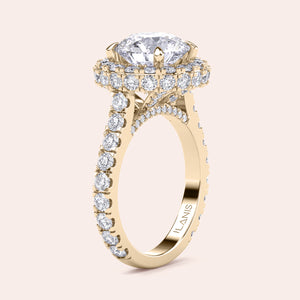 Elegant yellow gold engagement ring with a brilliant round-cut diamond center, encircled by a dazzling halo of smaller diamonds, adding opulence and sparkle. 