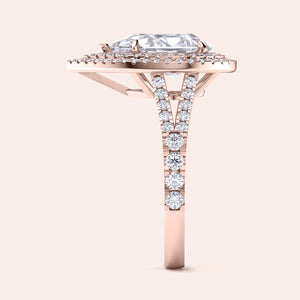 Elegant rose gold engagement ring featuring a cushion-cut center stone surrounded by a double halo of micro-pavé diamonds, showcasing intricate side detail. #14KRecycledRoseGold #18KRecycledRoseGold