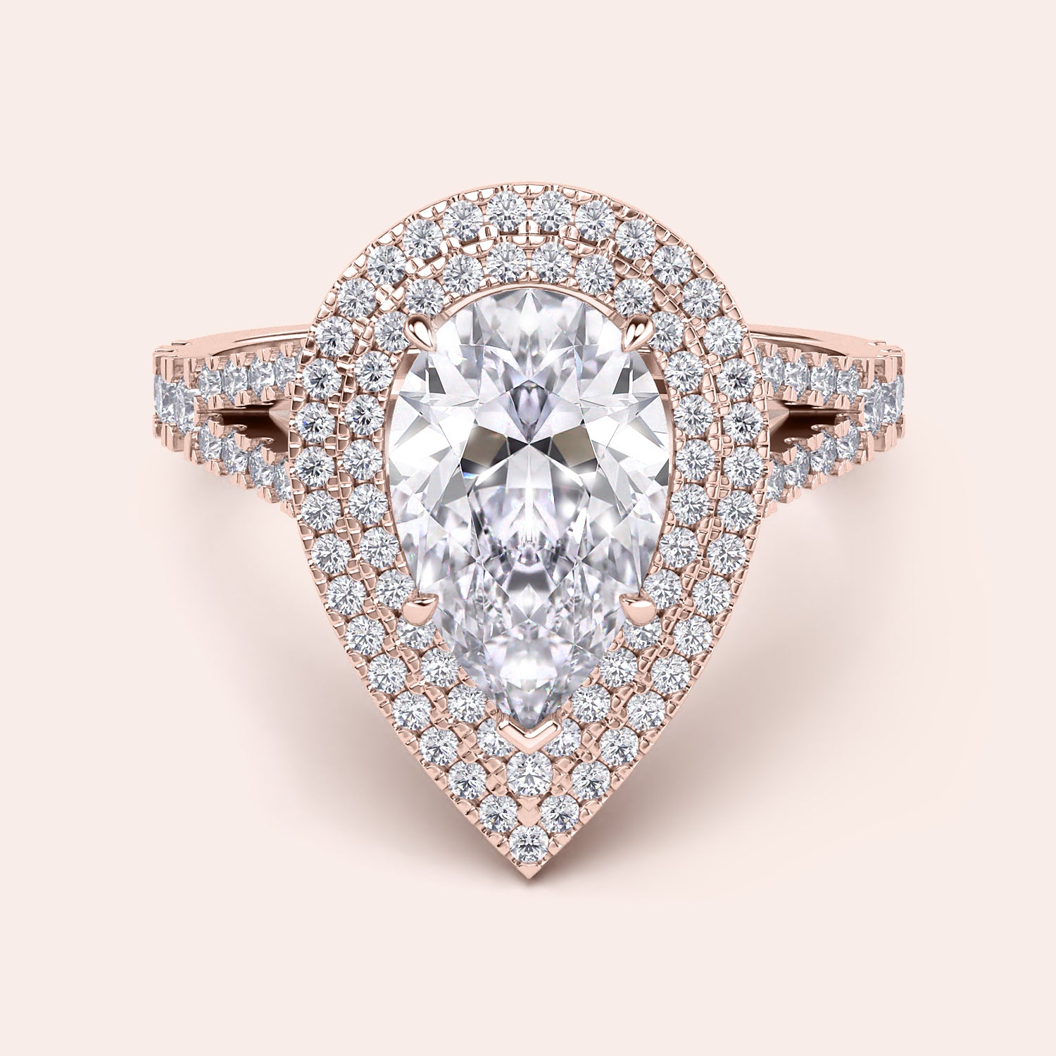 Charming rose gold engagement ring featuring a marquise diamond center stone encased in a sparkling double halo with a split shank pavé band. #14KRecycledRoseGold #18KRecycledRoseGold