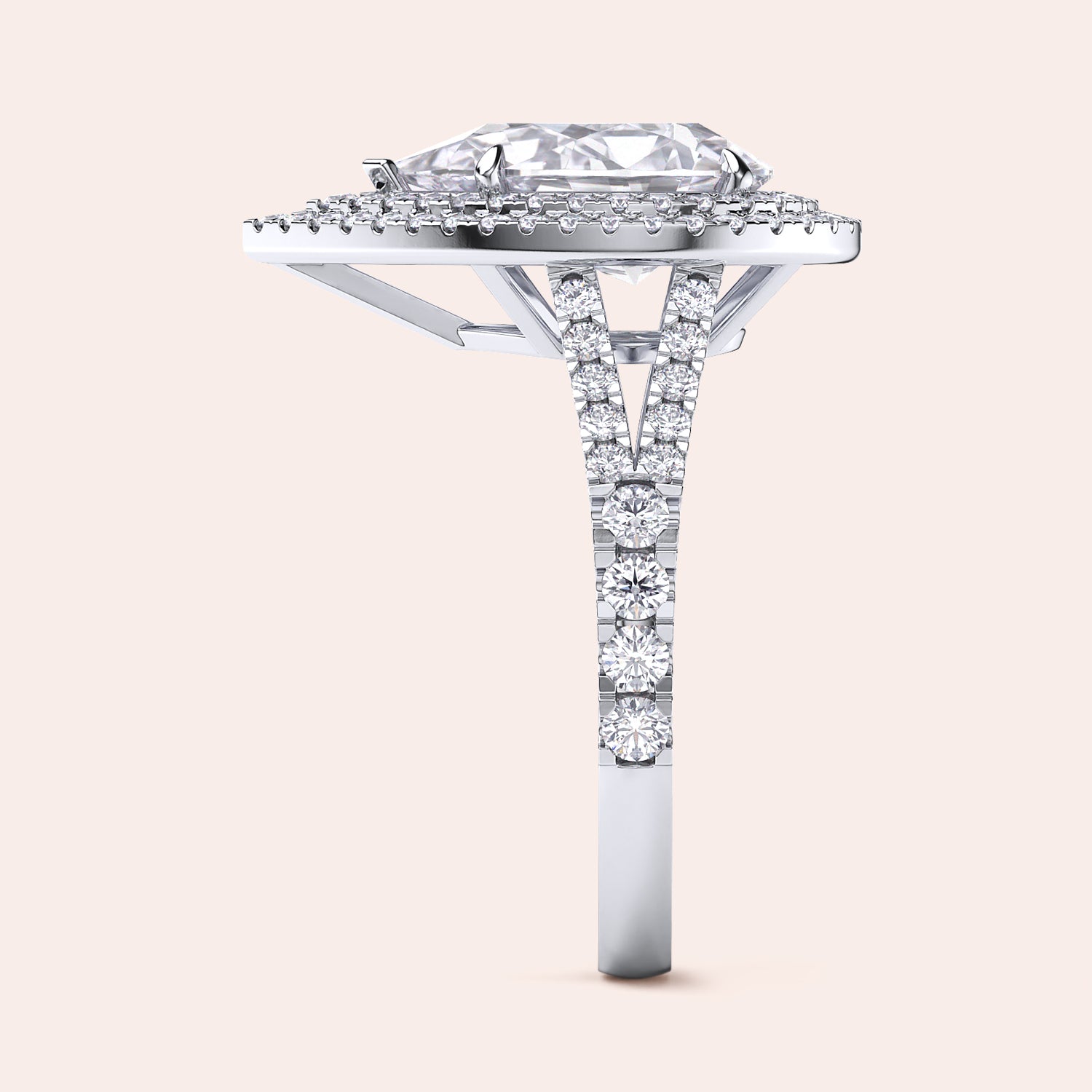Exquisite white gold engagement ring with a pear-shaped diamond centerpiece surrounded by a shimmering double halo of diamonds, set on a sleek band for a contemporary look. #14KRecycledWhiteGold #18KRecycledWhiteGold #Platinum