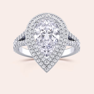 Captivating white gold engagement ring with a heart-shaped diamond, beautifully complemented by a double halo of sparkling diamonds and a split shank design that radiates elegance. #14KRecycledWhiteGold #18KRecycledWhiteGold #Platinum