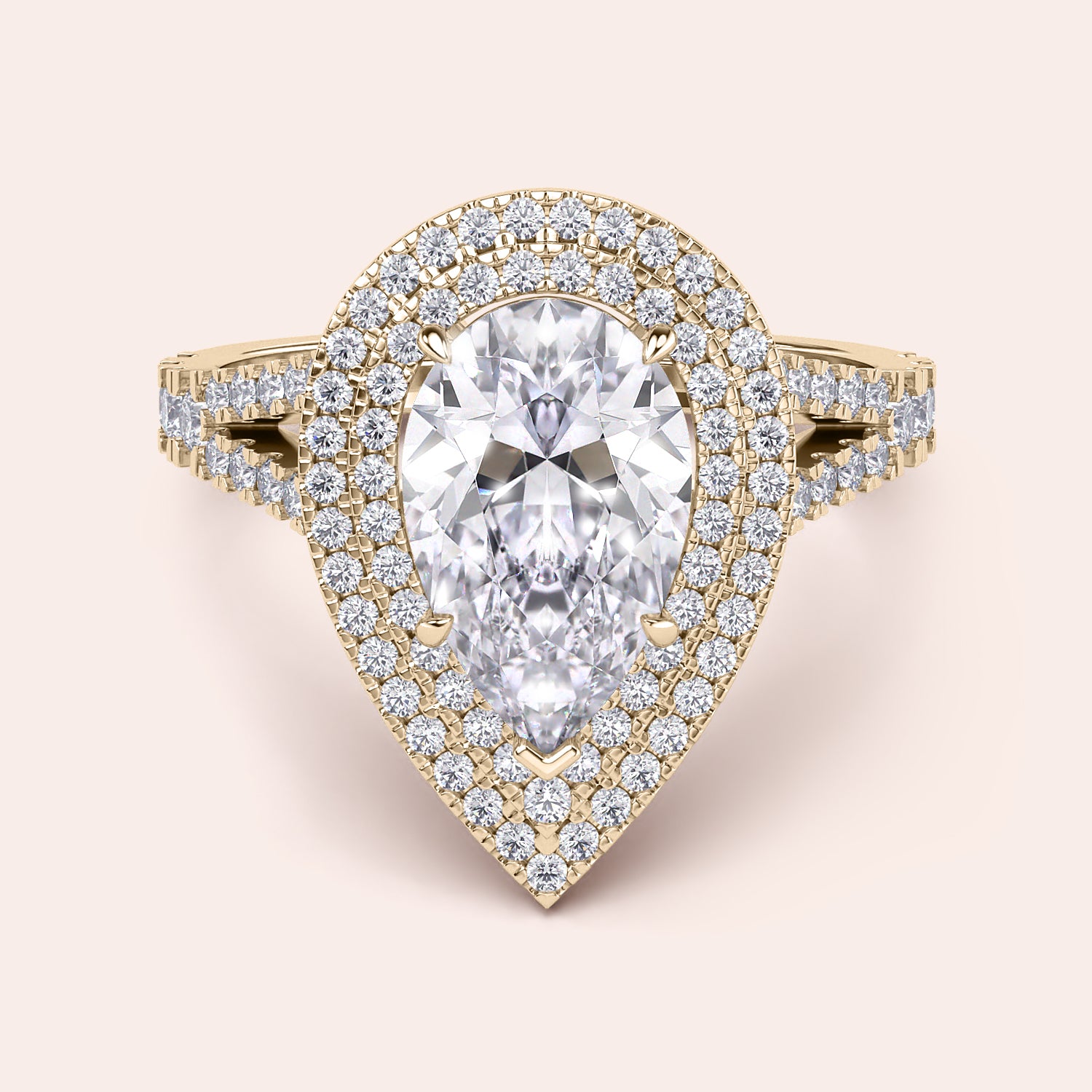 Chic yellow gold engagement ring displaying a radiant cushion-cut diamond at the center, accented by a delicate pavé setting along the split shank for a glamorous effect. #14KRecycledYellowGold #18KRecycledYellowGold