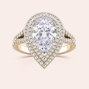 Captivating yellow gold engagement ring with a heart-shaped diamond, beautifully complemented by a double halo of sparkling diamonds and a split shank design that radiates elegance. #14KRecycledYellowGold #18KRecycledYellowGold