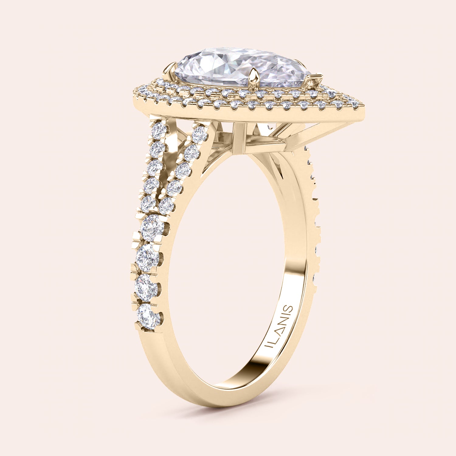 Exquisite yellow gold engagement ring with a pear-shaped diamond centerpiece surrounded by a shimmering double halo of diamonds, set on a sleek band for a modern touch. #14KRecycledYellowGold #18KRecycledYellowGold
