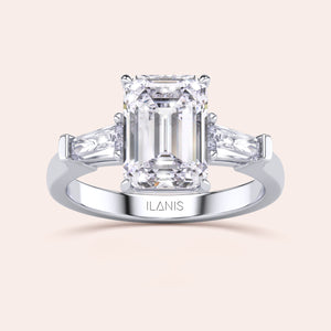 Minimalist yet stunning white gold engagement ring with a large emerald-cut center diamond, highlighted by its clean and simple design. 