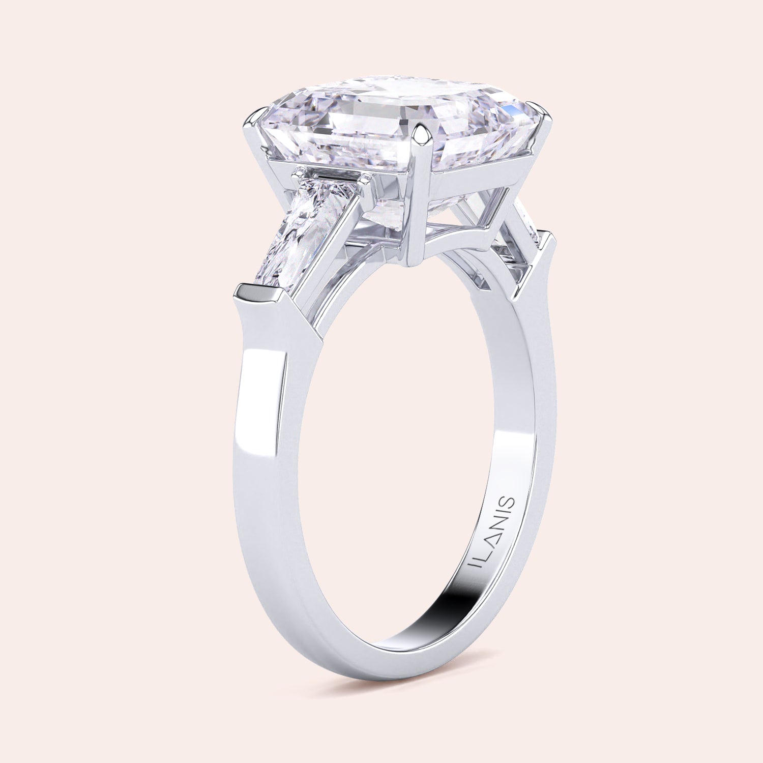 Elegant white gold engagement ring featuring a radiant cut center diamond with two side baguettes on a smooth band | #14KRecycledWhiteGold #18KRecycledWhiteGold 
#Platinum