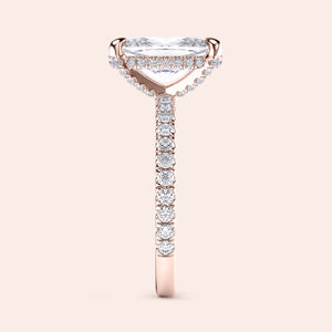 Exquisite rose gold engagement ring, 14K/18K, featuring a cushion pave hidden halo and side diamonds for added sparkle.