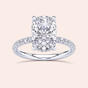 Elegant 14K or 18K white gold engagement ring with cushion-cut diamond and pave halo, perfect for timeless love.