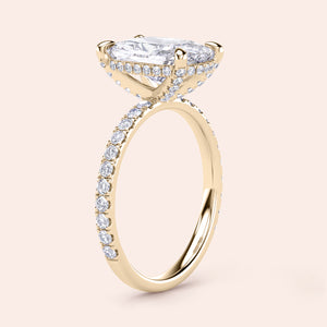14K yellow gold engagement ring featuring a marquise-cut diamond and pave setting, exuding timeless luxury and elegance.
