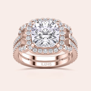 Stunning rose gold engagement ring with cushion-cut diamond and round diamond halo, available in 14K, 18K, or platinum. Not worn on model.