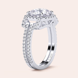 Elegant 14K/18K white gold engagement ring with marquise-cut diamond halo and split shank, accented with round diamonds.