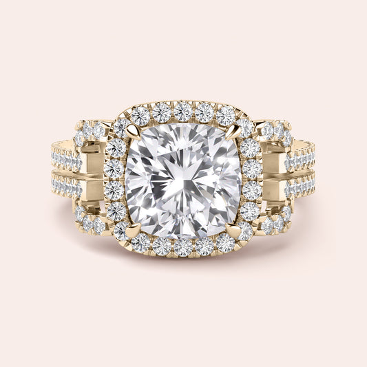 Close-up of a luxurious 14K yellow gold cushion-cut diamond engagement ring with a double halo and intricate detailing.