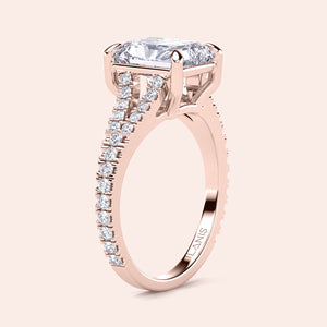Elegant rose gold engagement ring with elongated cushion-cut diamond center, split band, and pave diamonds. Available in 14K, 18K, or platinum.
