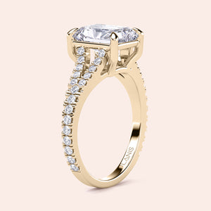 Elegant 14K yellow gold engagement ring with radiant cut diamond center, surrounded by sparkling smaller diamonds on the band.