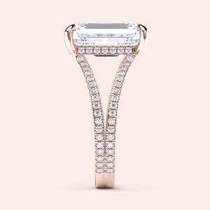 Elegant 14K or 18K rose gold engagement ring featuring an emerald-cut diamond, with aPave-set diamond band, showcasing fine craftsmanship.