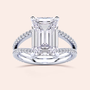 Emerald-cut diamond engagement ring withPave band in 14K or 18K gold, featuring a split shank and hidden halo design.