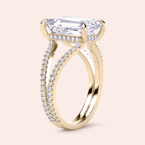 Stunning yellow gold engagement ring with emerald, split shank, hidden halo, available in 14K, 18K, and platinum.