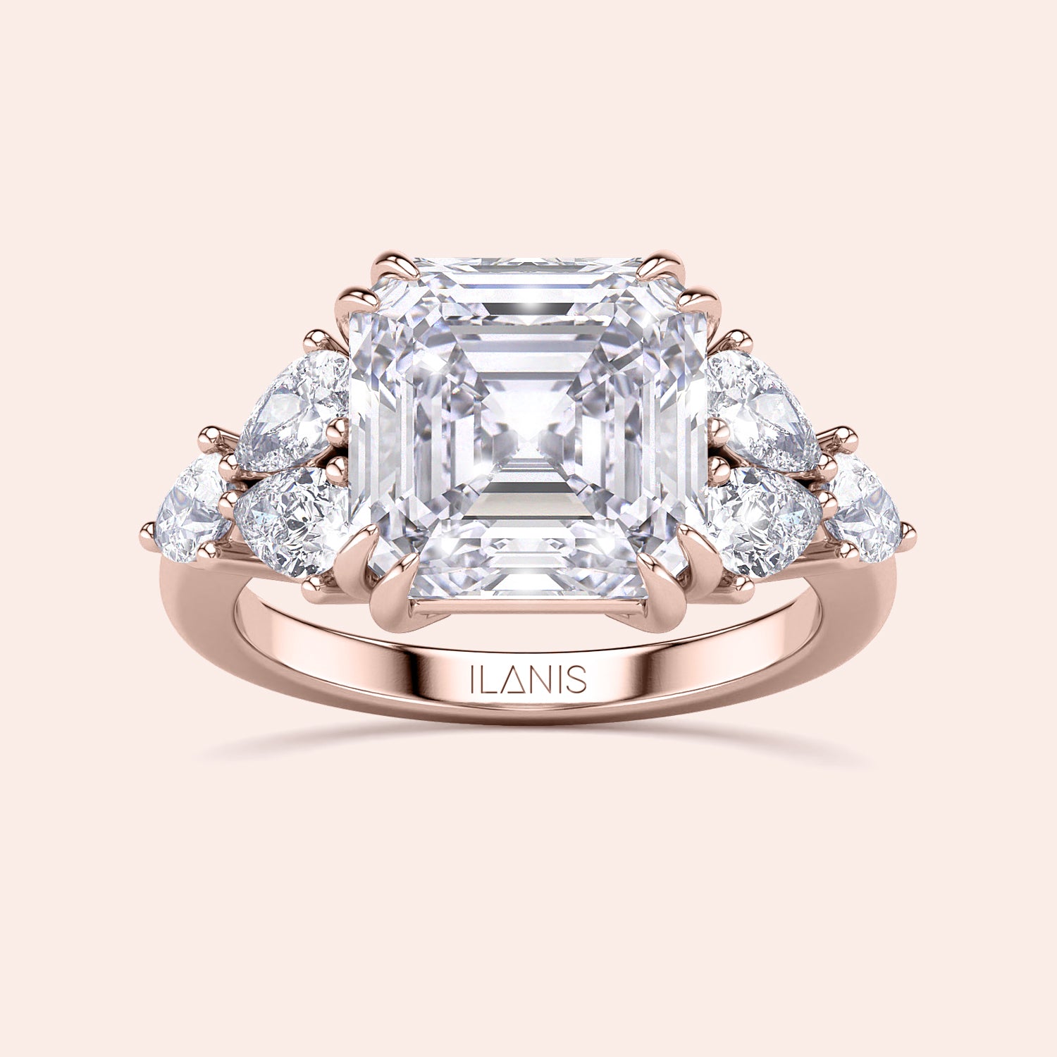 Elegant rose gold engagement ring featuring an asscher and pear cut diamond, surrounded by accent diamonds, in 14K/18K gold or platinum.|







#14KRecycledRoseGold
#18KRecycledRoseGold


