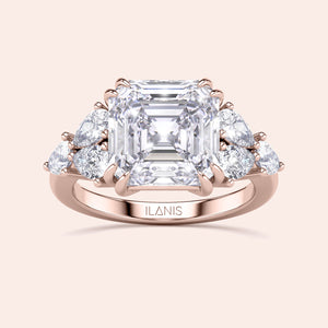 Elegant rose gold engagement ring featuring an asscher and pear cut diamond, surrounded by accent diamonds, in 14K/18K gold or platinum.