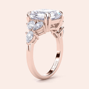 Elegant rose gold engagement ring featuring asscher and pear cut diamonds, available in 14K, 18K, or platinum settings.